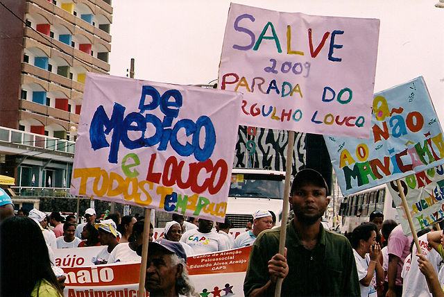 Banners and bright colour signs from the mad pride parade in Salvador, Brazil