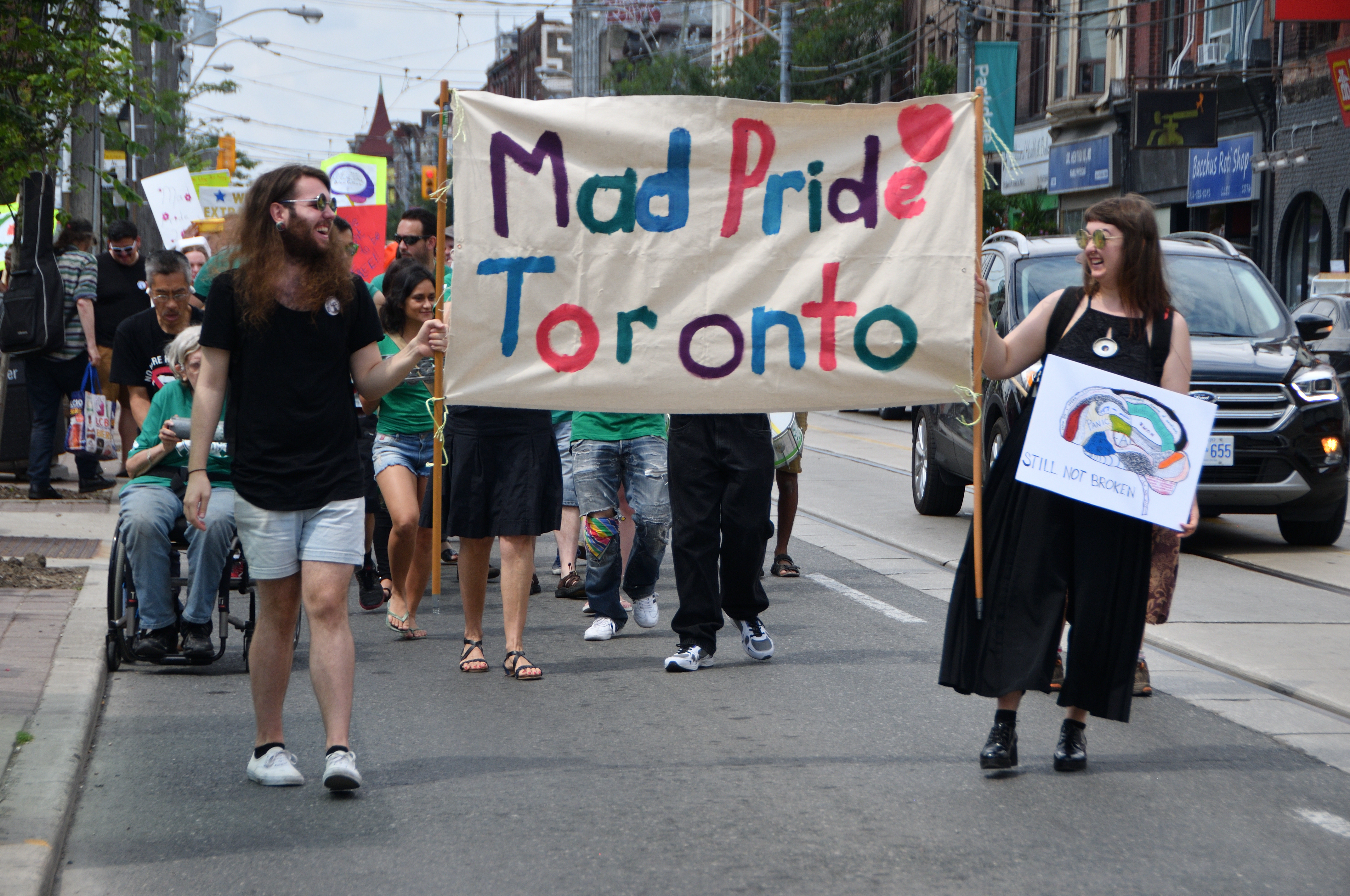 Mad Pride Banner at front of parade.